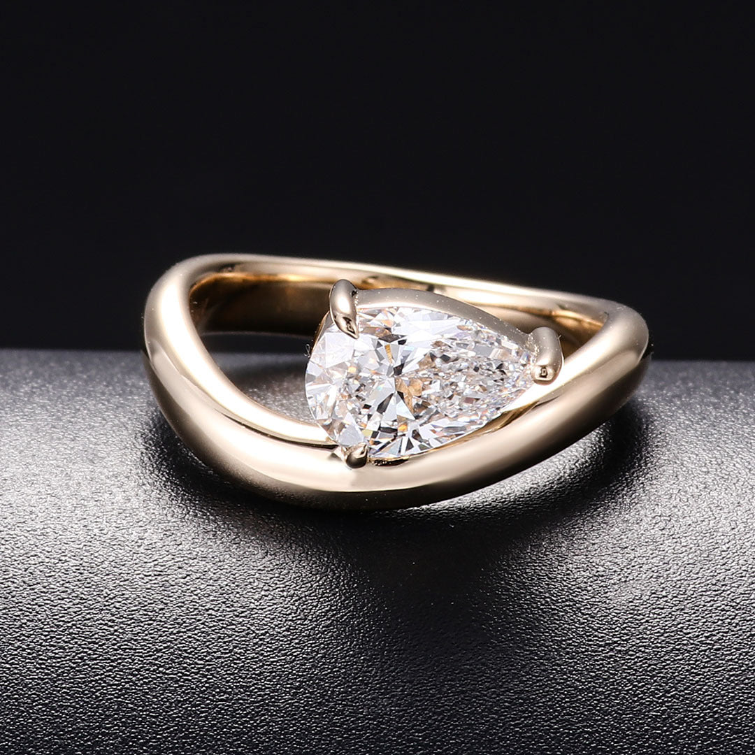 Pear-Shaped Twist Diamond Ring | 14/18K Solid Gold - Close-up Detail - Pebble and Glow Luxury Jewelry