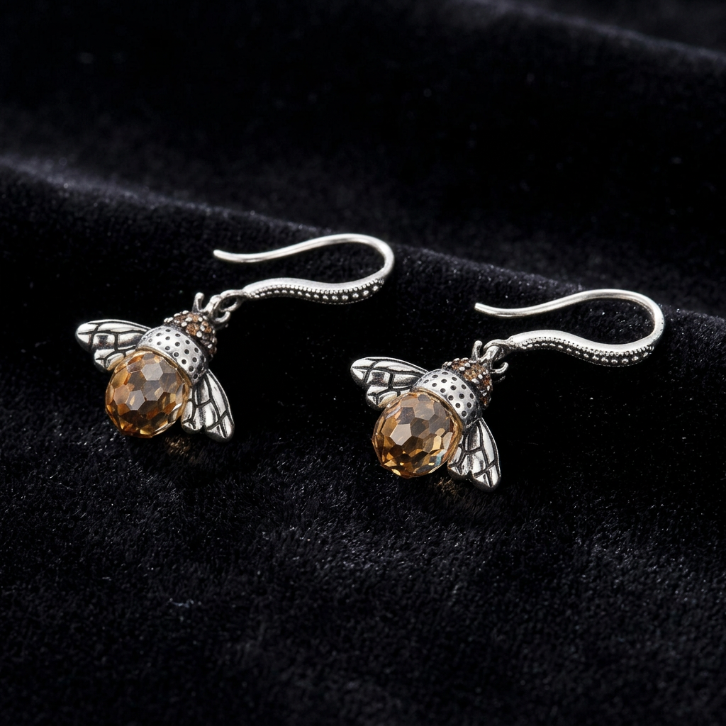 Hand-Forged Spectral Bee | Original Artisanal Drop Earrings - Main Front View - Pebble and Glow Luxury Jewelry Collage